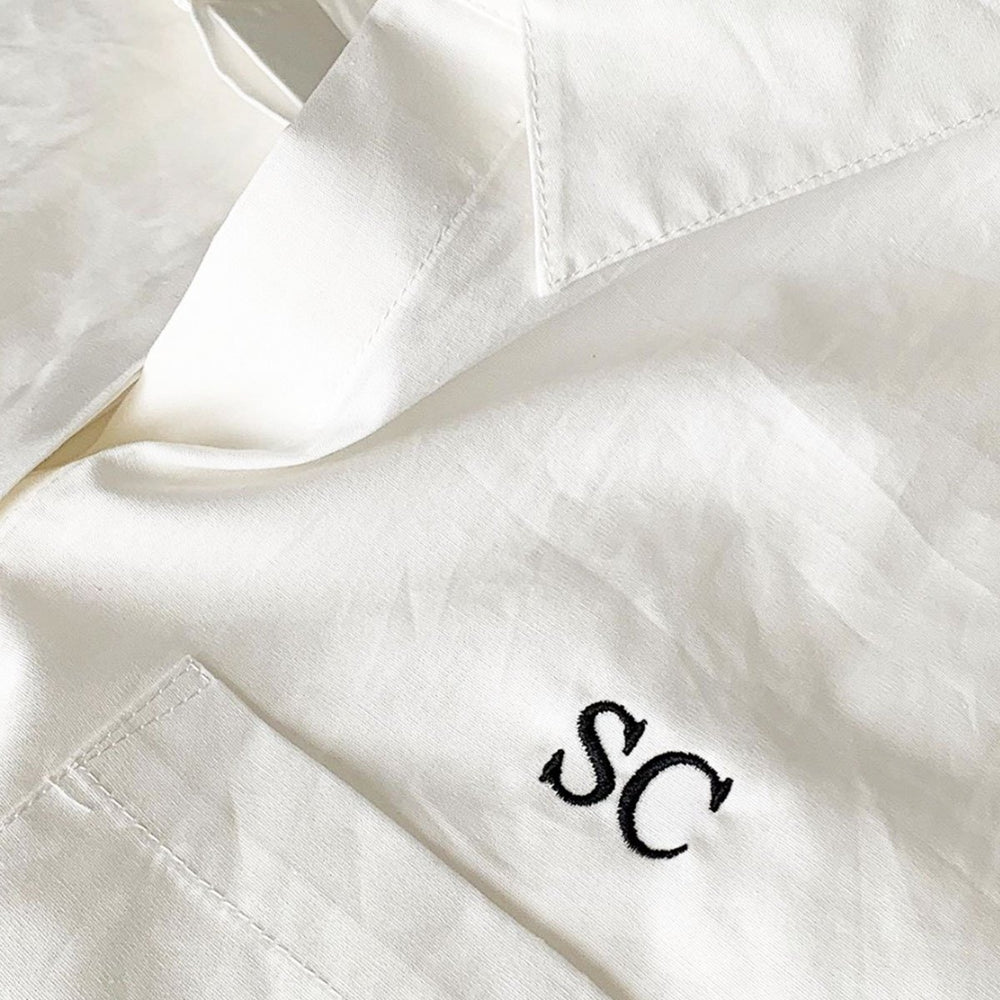 
                      
                        Embroidered initials on shirt
                      
                    