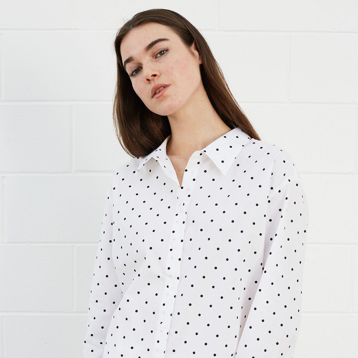 
                  
                    Woman wearing polka dot shirt
                  
                
