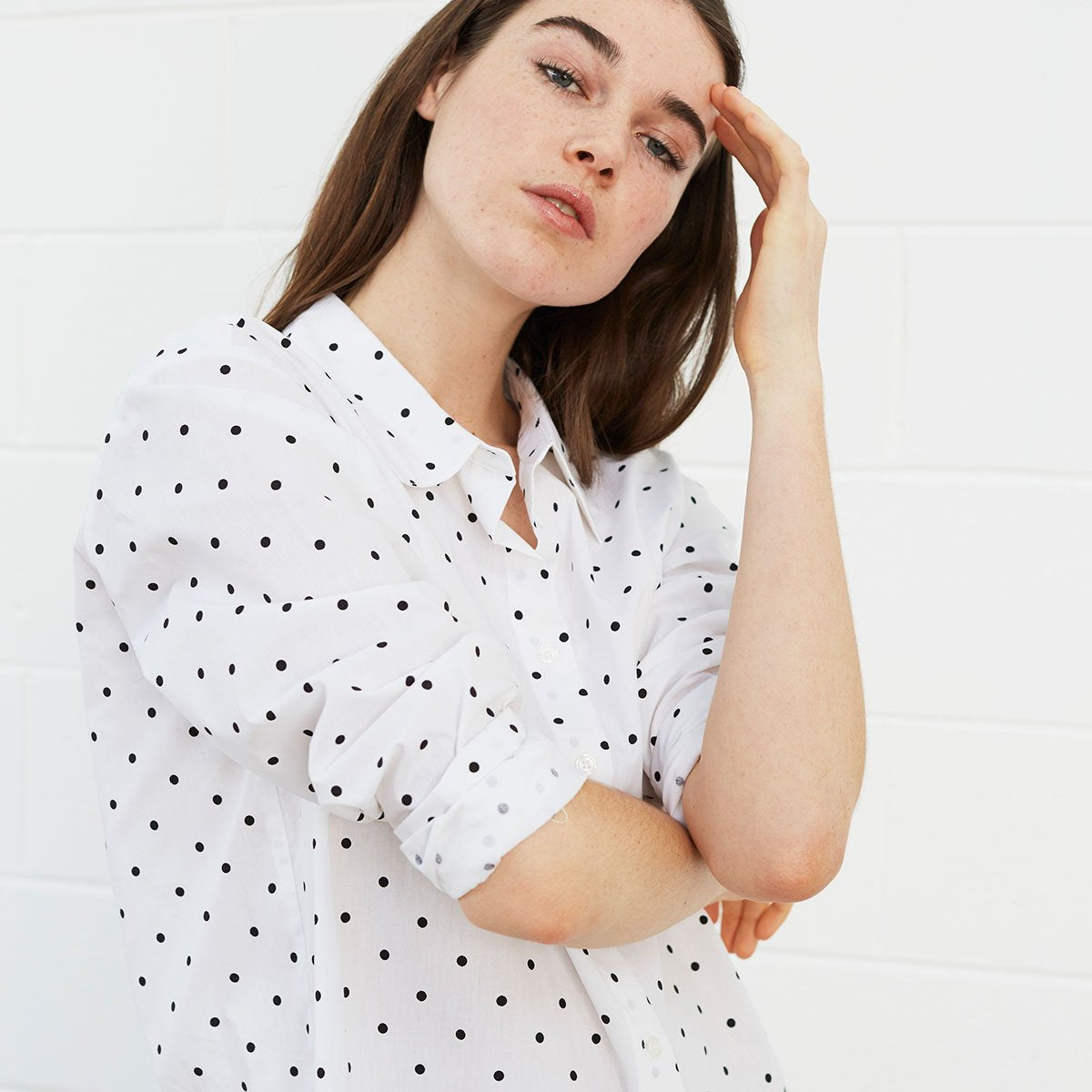 
                  
                    Woman wearing polka dot shirt
                  
                