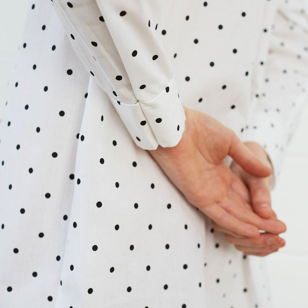 
                  
                    Close up of woman wearing polka dot shirt dress
                  
                