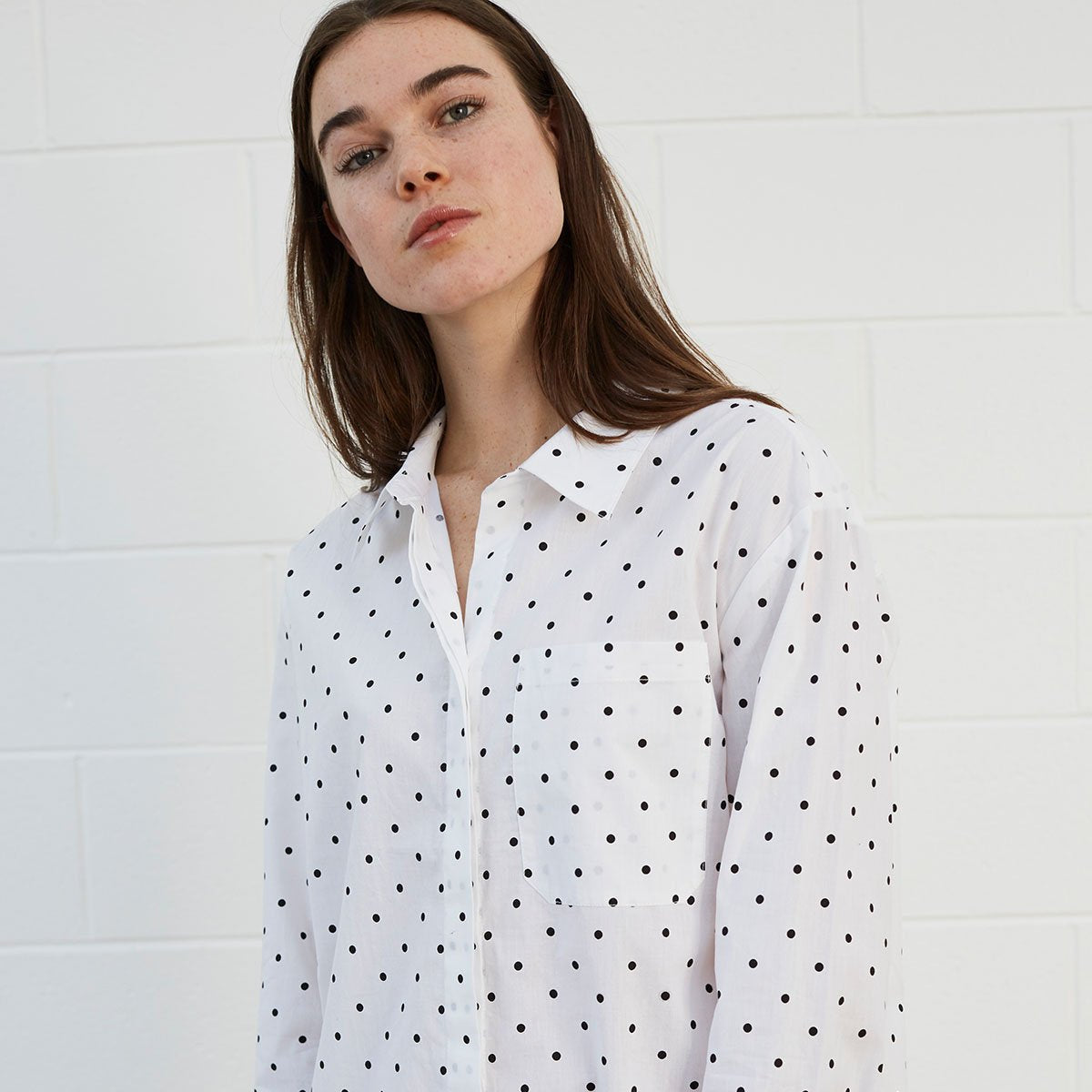 
                  
                    Woman wearing polka dot shirt dress
                  
                