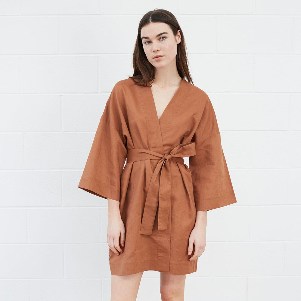 Woman wearing brown robe