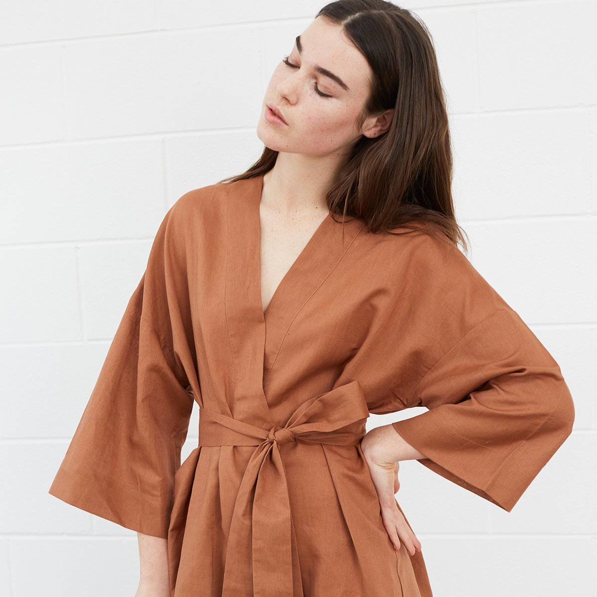 
                  
                    Woman wearing brown robe
                  
                