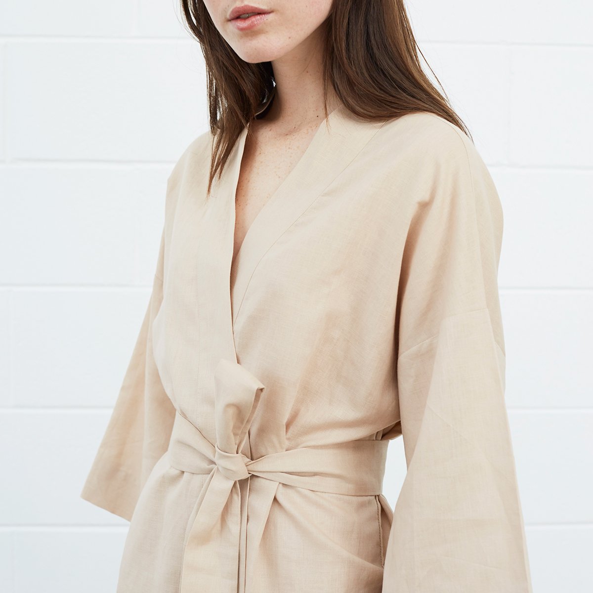 Close up of woman weaing beige robe