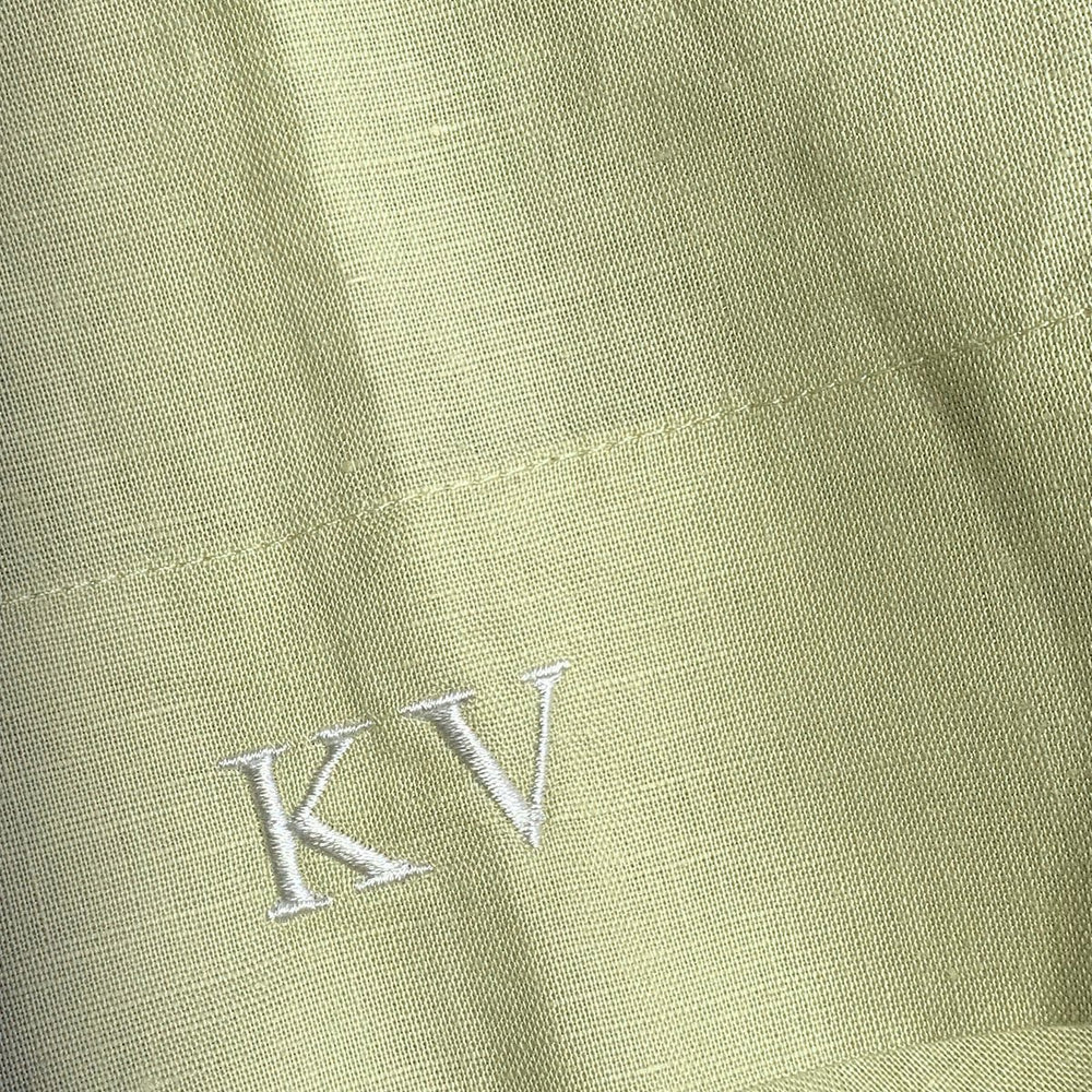 
                      
                        Embroidered initials on shirt
                      
                    