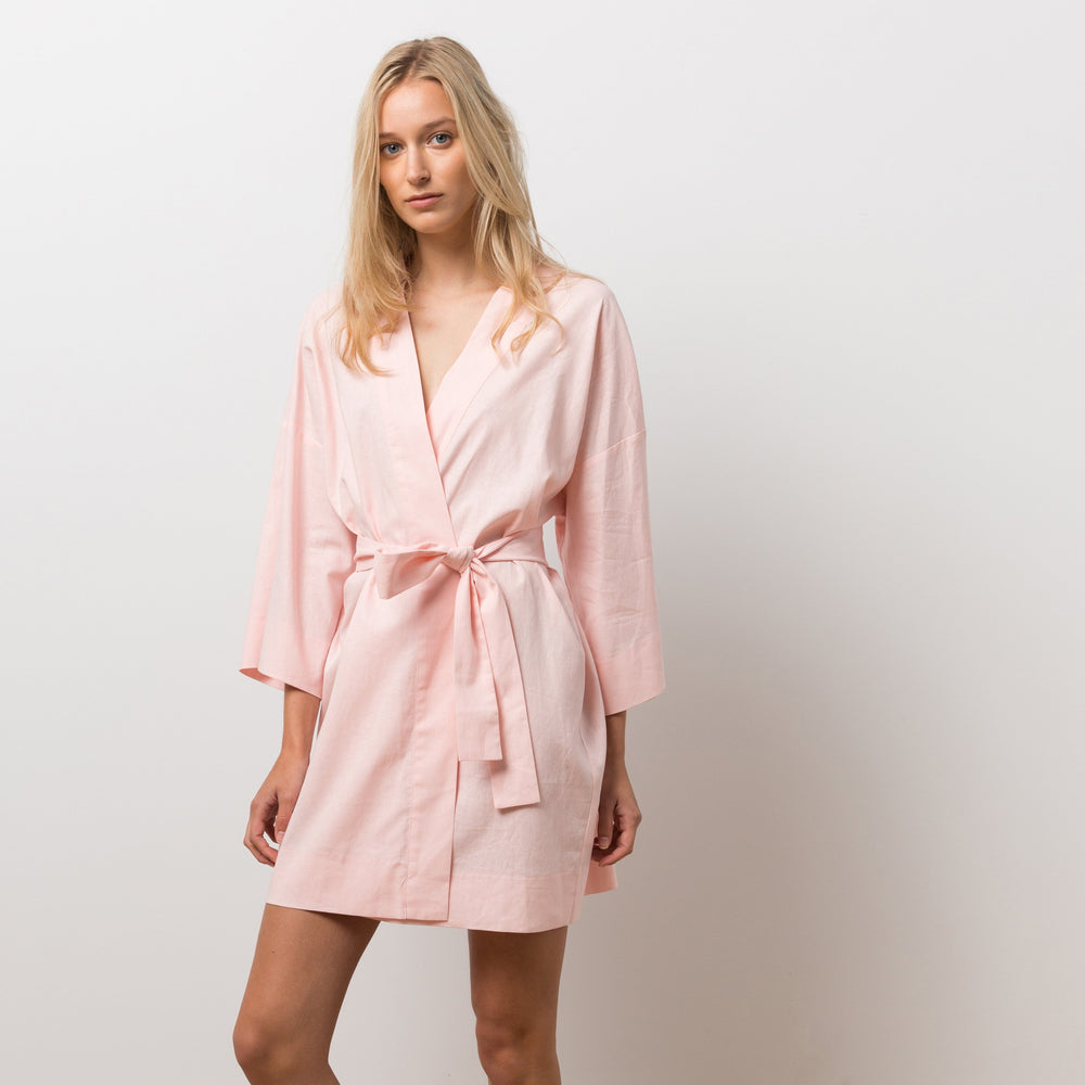 Woman wearing pink robe