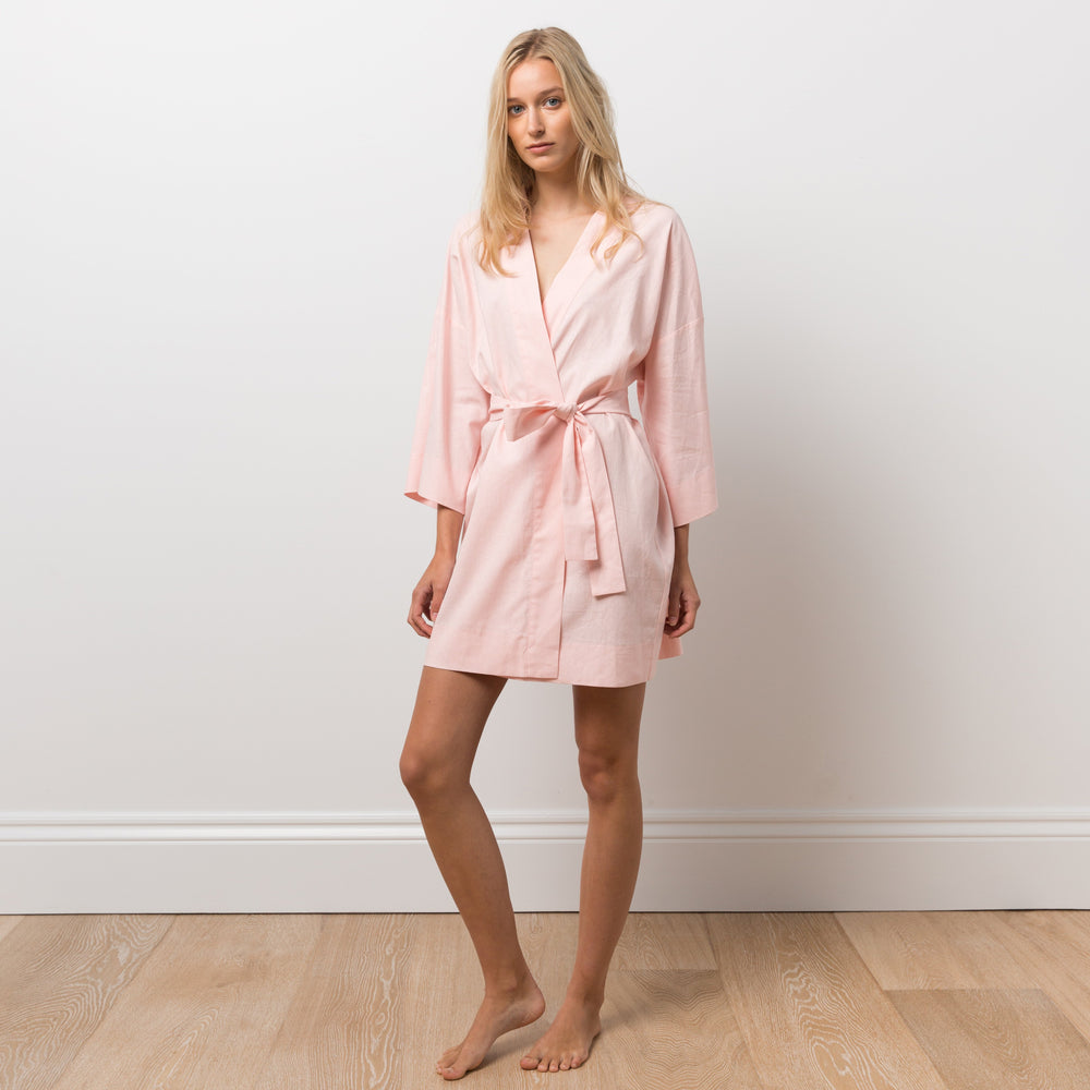 
                  
                    Woman wearing pink robe
                  
                