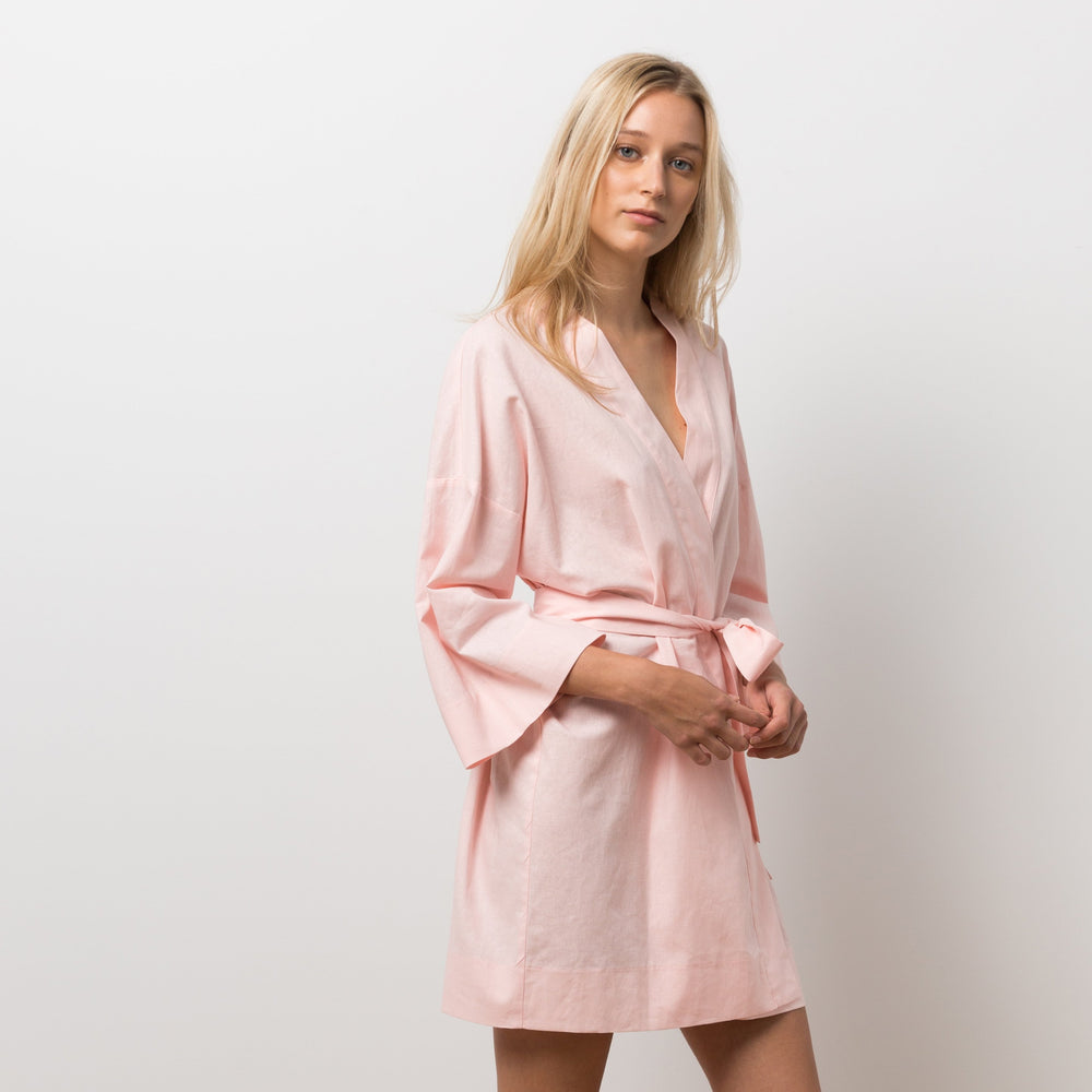 Woman wearing pink robe