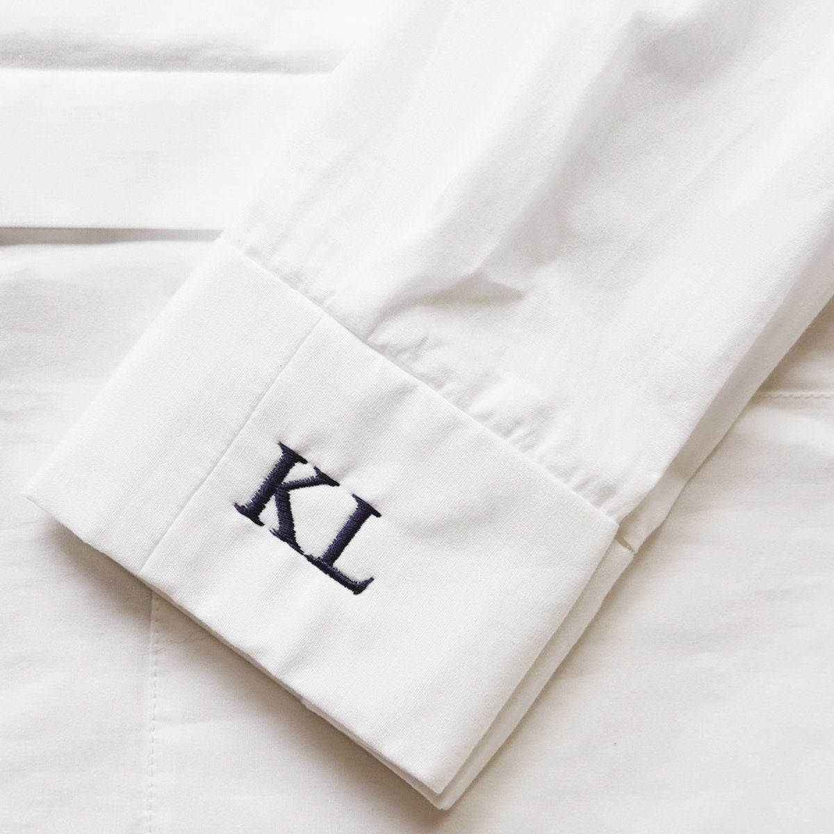 
                  
                    Embroidered initials on shirt
                  
                